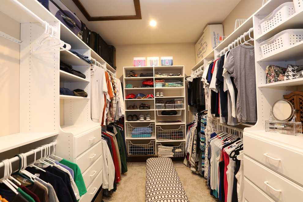 Inspiration for a large rustic gender-neutral carpeted and white floor walk-in closet remodel in Denver with flat-panel cabinets and white cabinets