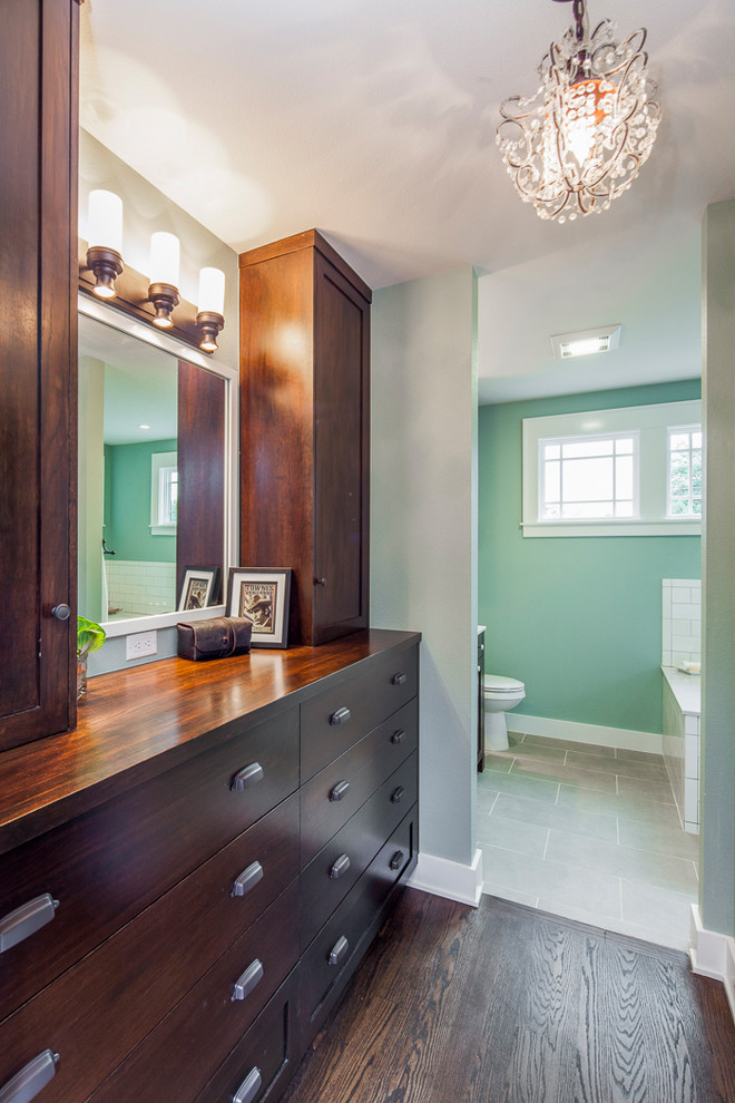 Arts and crafts gender-neutral dark wood floor and brown floor dressing room photo in Austin with shaker cabinets and dark wood cabinets