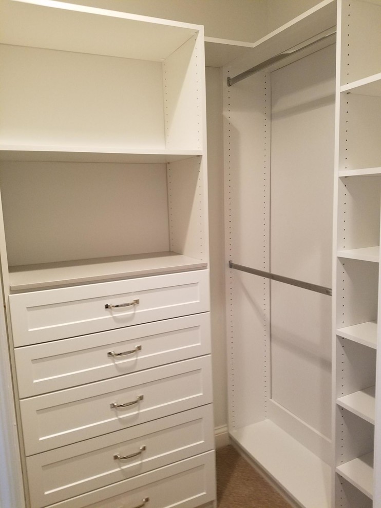Walk-in closet - small traditional gender-neutral carpeted and brown floor walk-in closet idea in Louisville with open cabinets and white cabinets