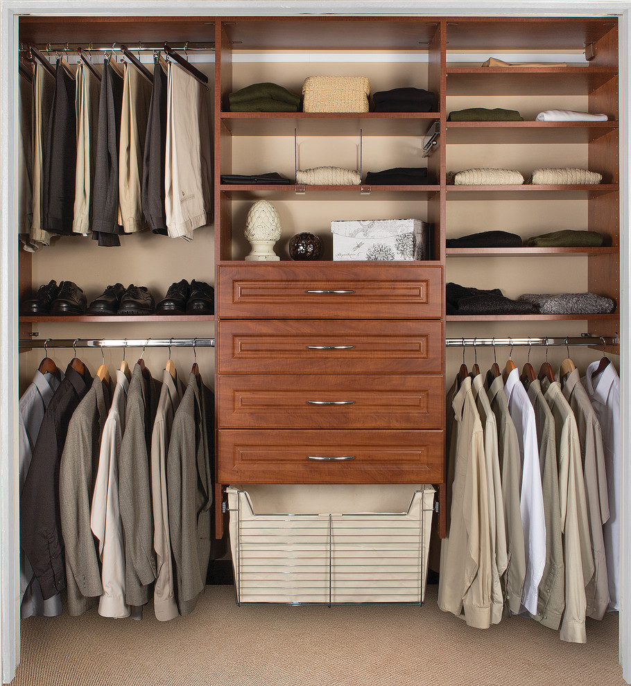 Example of a mid-sized transitional men's carpeted and beige floor walk-in closet design in Phoenix with recessed-panel cabinets and medium tone wood cabinets