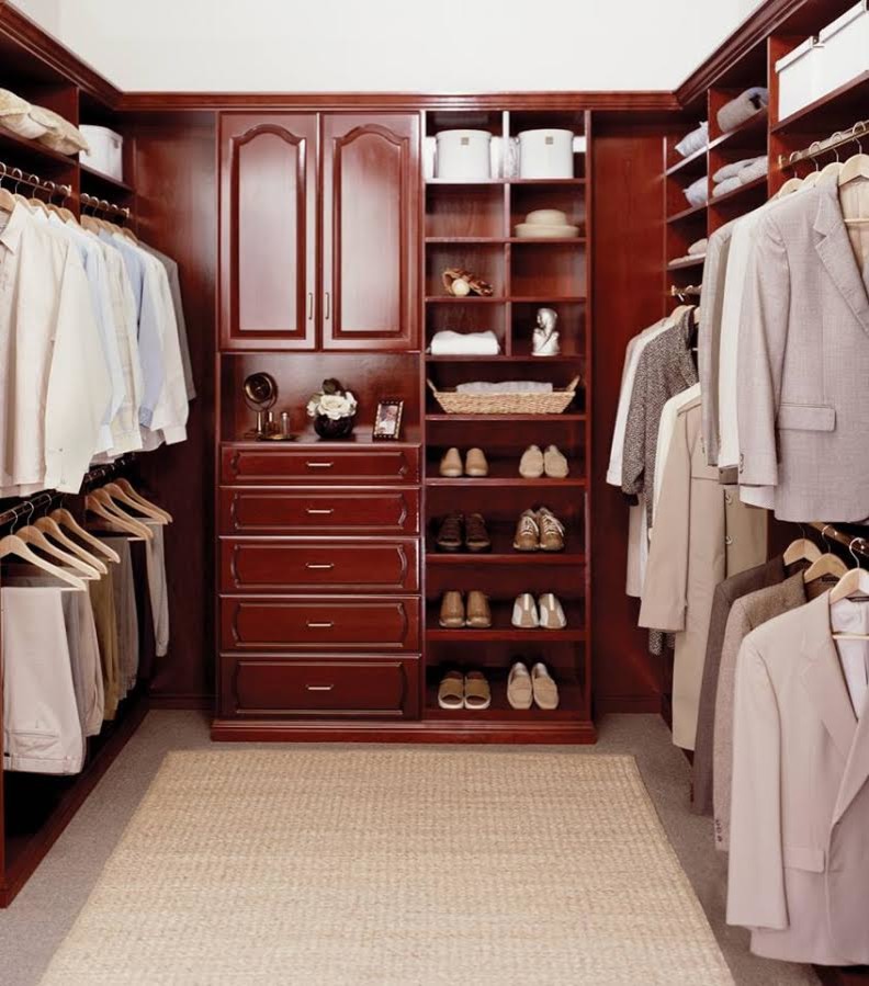 Mid-sized transitional men's carpeted and beige floor walk-in closet photo in Louisville with raised-panel cabinets and medium tone wood cabinets