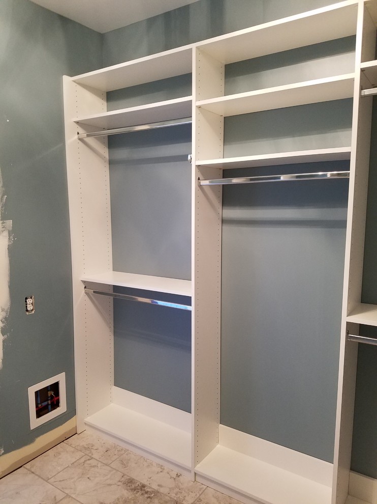 Medium sized classic gender neutral walk-in wardrobe in Louisville with open cabinets, white cabinets, porcelain flooring and beige floors.