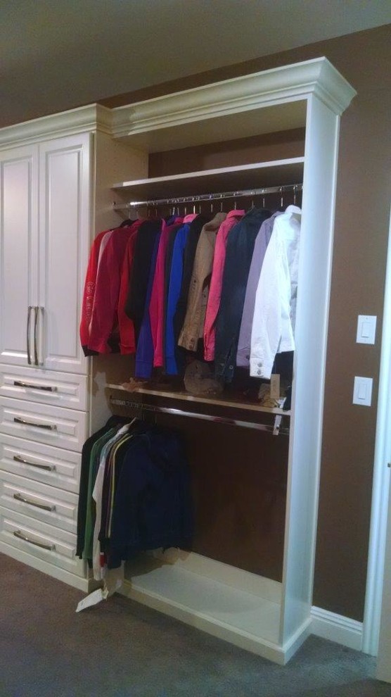 Inspiration for a mid-sized timeless gender-neutral carpeted and brown floor walk-in closet remodel in Louisville with raised-panel cabinets and white cabinets