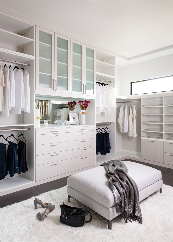 Huge women's dark wood floor and brown floor walk-in closet photo in Philadelphia with shaker cabinets and white cabinets