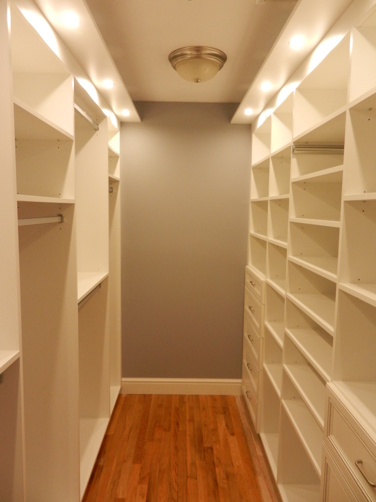 This is an example of a large traditional gender neutral walk-in wardrobe in Other.