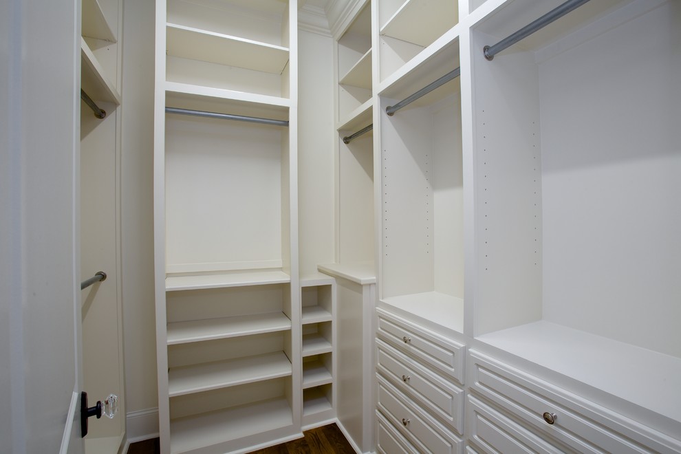 Example of a transitional closet design in Other