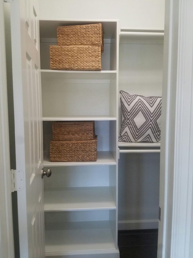 Inspiration for a medium sized traditional gender neutral walk-in wardrobe in Houston with open cabinets, white cabinets, dark hardwood flooring and brown floors.