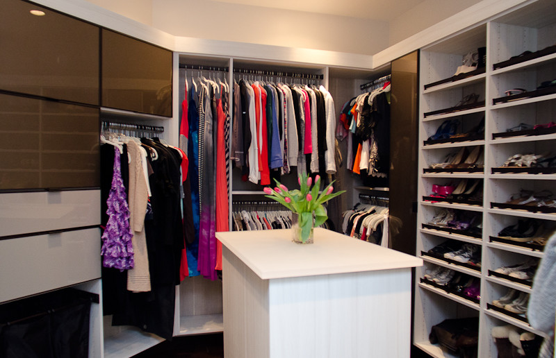 Mid-sized trendy women's dark wood floor walk-in closet photo in Indianapolis with open cabinets and brown cabinets