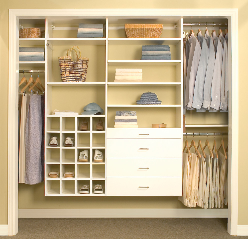 Medium sized contemporary gender neutral standard wardrobe in Charleston with flat-panel cabinets, white cabinets, carpet and brown floors.