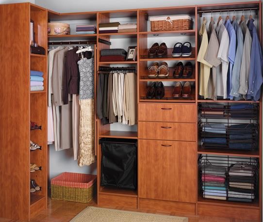 Inspiration for a medium sized modern gender neutral walk-in wardrobe in Other with flat-panel cabinets and medium wood cabinets.