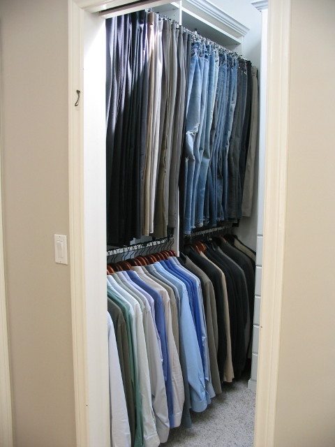 Example of a small trendy gender-neutral carpeted and gray floor walk-in closet design in Los Angeles