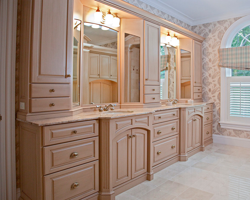 Design ideas for a large traditional bathroom in Boston with raised-panel cabinets, light wood cabinets and beige floors.