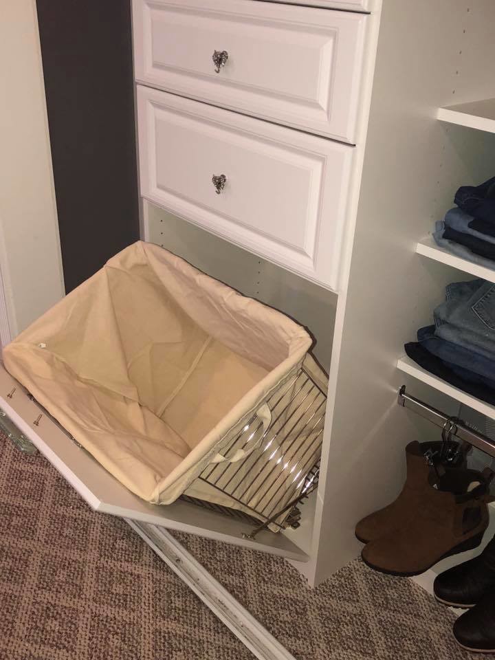 This is an example of a medium sized contemporary standard wardrobe for women in Cleveland with raised-panel cabinets, white cabinets, carpet and beige floors.