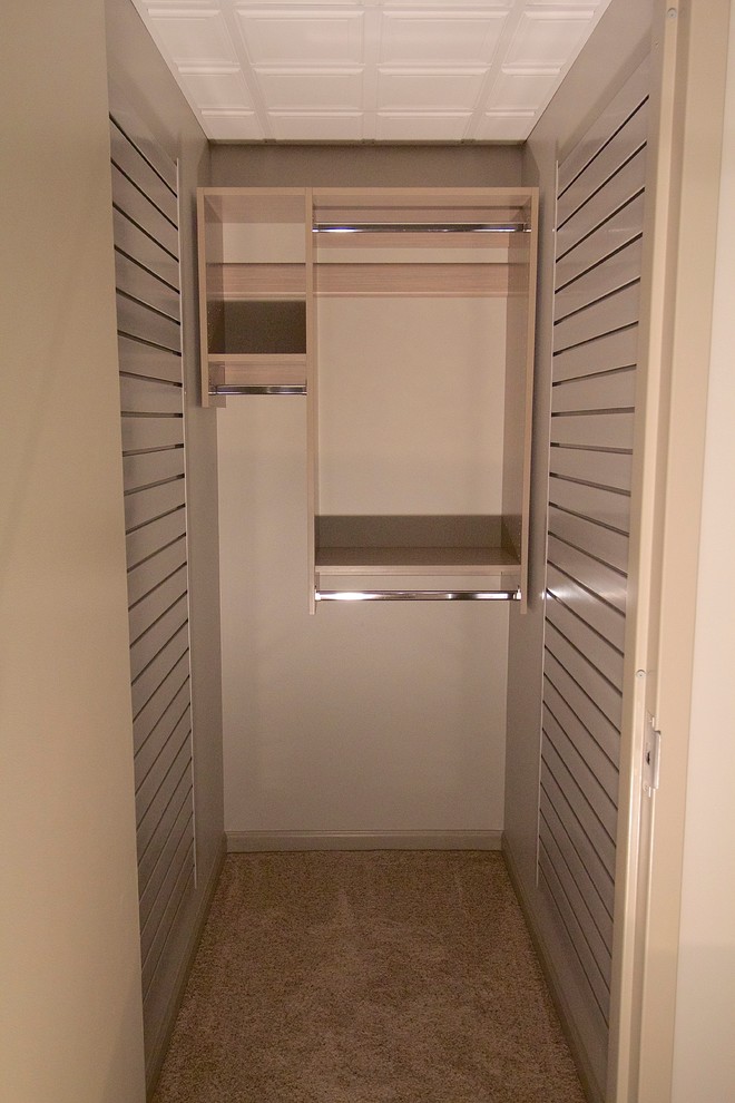 Inspiration for a small gender-neutral reach-in closet remodel in Other