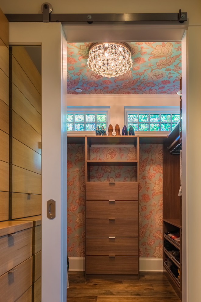Mid-sized eclectic women's dark wood floor walk-in closet photo in San Francisco with flat-panel cabinets and medium tone wood cabinets