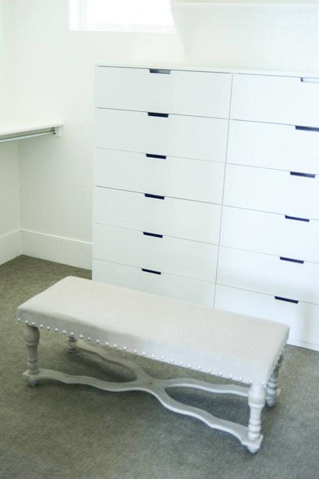Photo of a small classic gender neutral walk-in wardrobe in Salt Lake City with flat-panel cabinets, white cabinets and carpet.