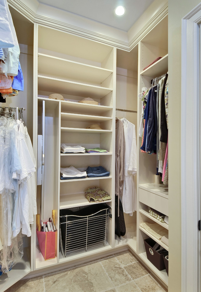 Example of a transitional closet design in Charleston