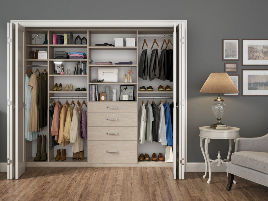 Inspiration for a small contemporary gender neutral standard wardrobe in Nashville with open cabinets, light wood cabinets and medium hardwood flooring.