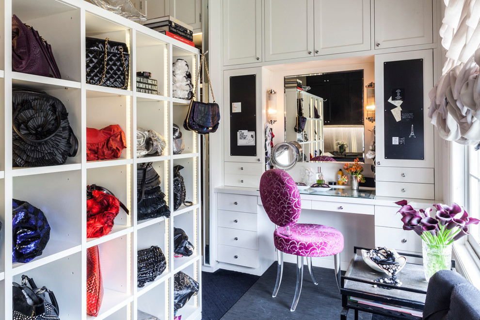 Example of a classic carpeted dressing room design in New York with white cabinets