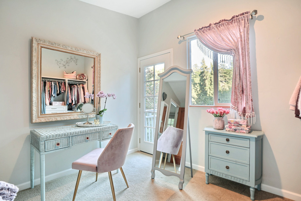 Medium sized vintage dressing room for women with shaker cabinets, white cabinets, carpet and beige floors.
