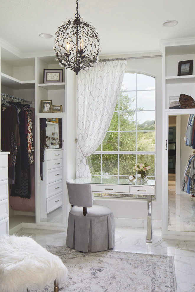 Inspiration for a medium sized classic dressing room for women in Austin with white cabinets, porcelain flooring, white floors and open cabinets.