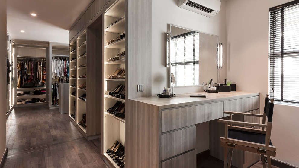 Large trendy women's medium tone wood floor walk-in closet photo in Singapore with open cabinets and white cabinets