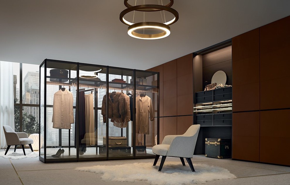 Inspiration for a medium sized contemporary gender neutral walk-in wardrobe in DC Metro with flat-panel cabinets, dark wood cabinets and beige floors.
