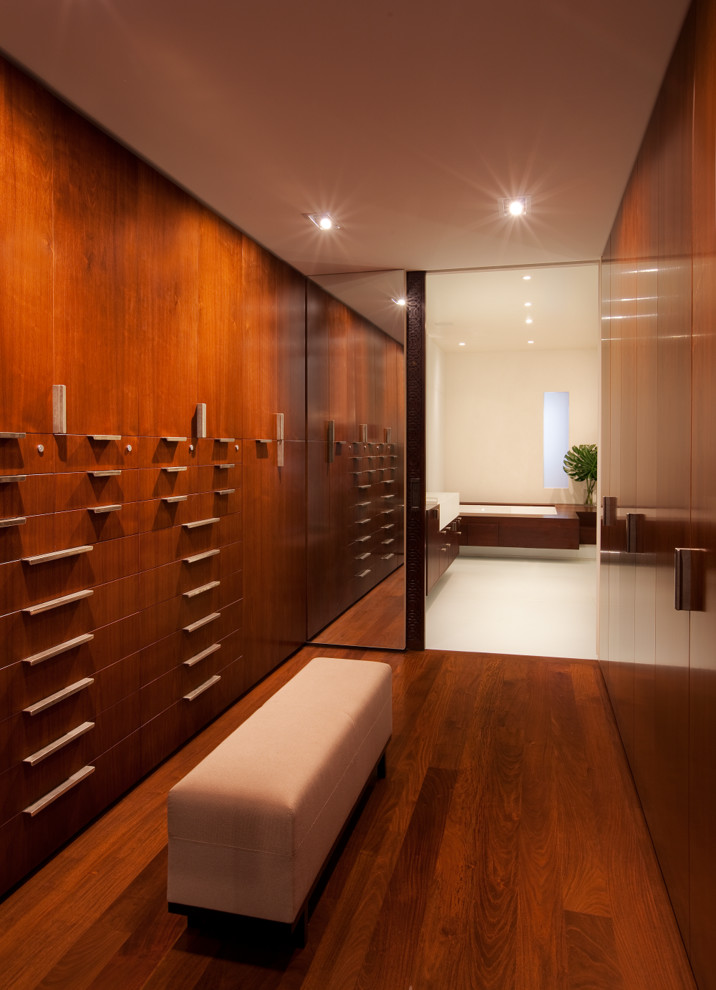 Example of a trendy walk-in closet design in New York