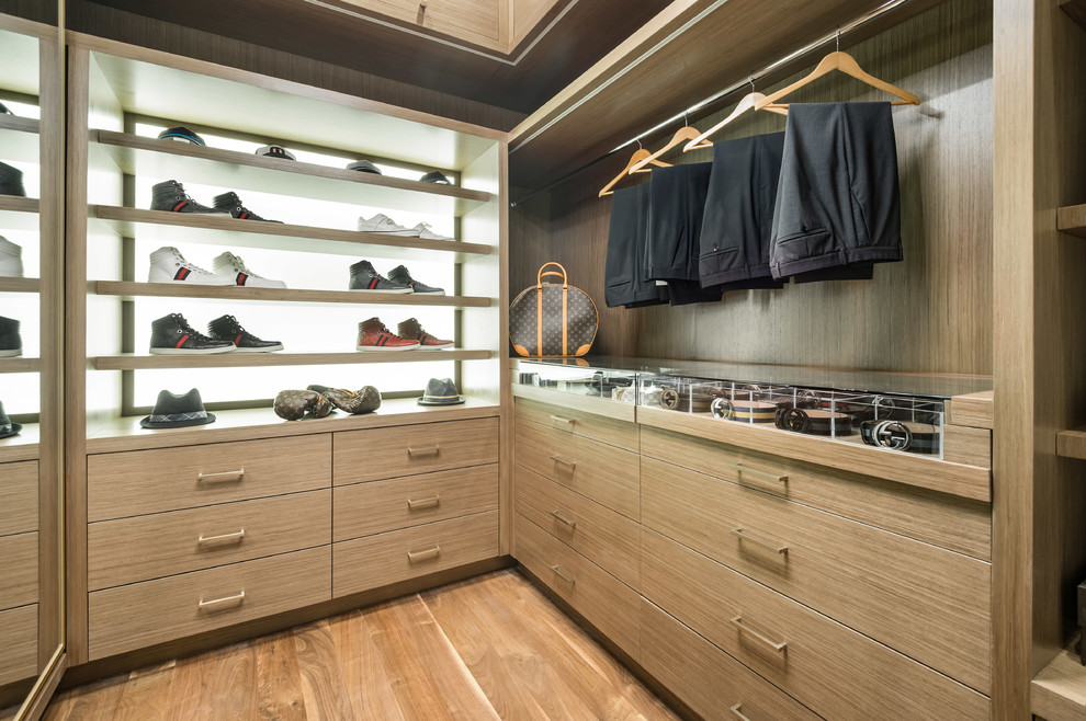 Inspiration for a contemporary walk-in wardrobe for men in Los Angeles with flat-panel cabinets, light wood cabinets, light hardwood flooring and beige floors.
