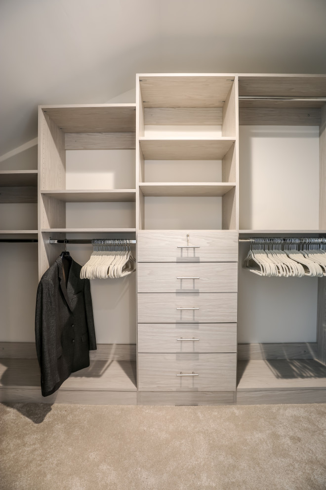 Design ideas for a medium sized contemporary wardrobe in DC Metro with white cabinets.