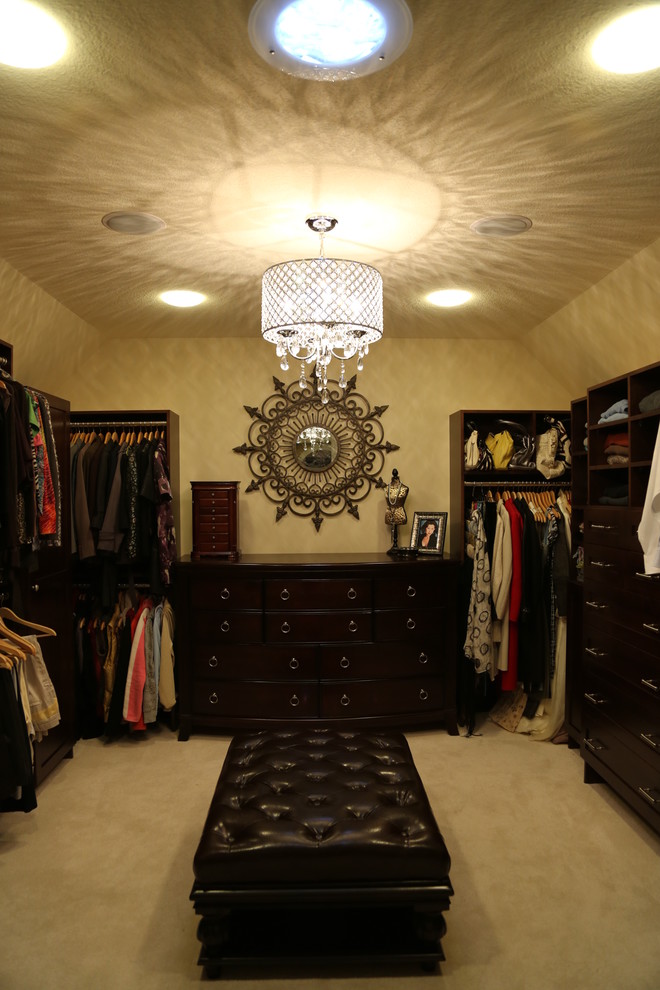 Large transitional carpeted dressing room photo in Minneapolis with dark wood cabinets