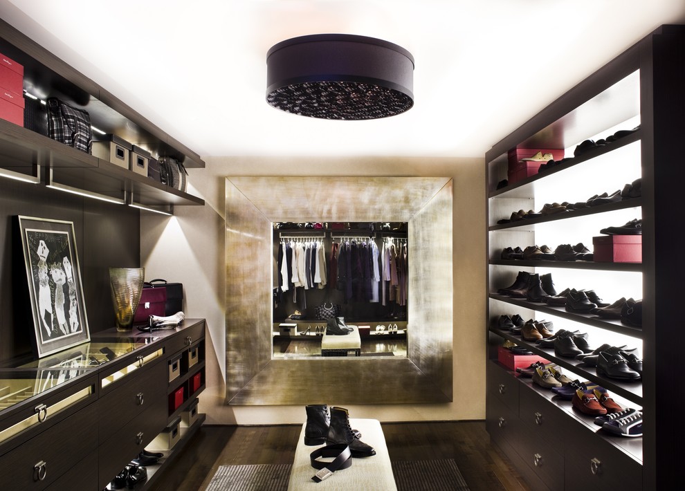 Walk-in closet - contemporary walk-in closet idea in Los Angeles with dark wood cabinets