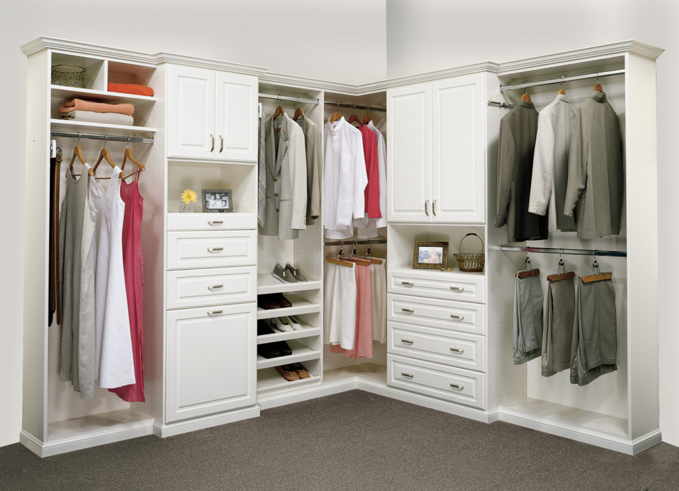 Walk-in closet - large traditional gender-neutral walk-in closet idea in Orange County with raised-panel cabinets and white cabinets