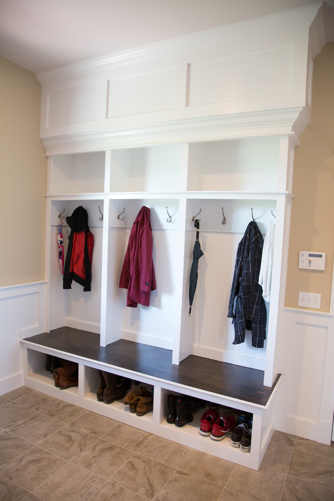 Huge arts and crafts gender-neutral walk-in closet photo in Burlington with open cabinets and white cabinets