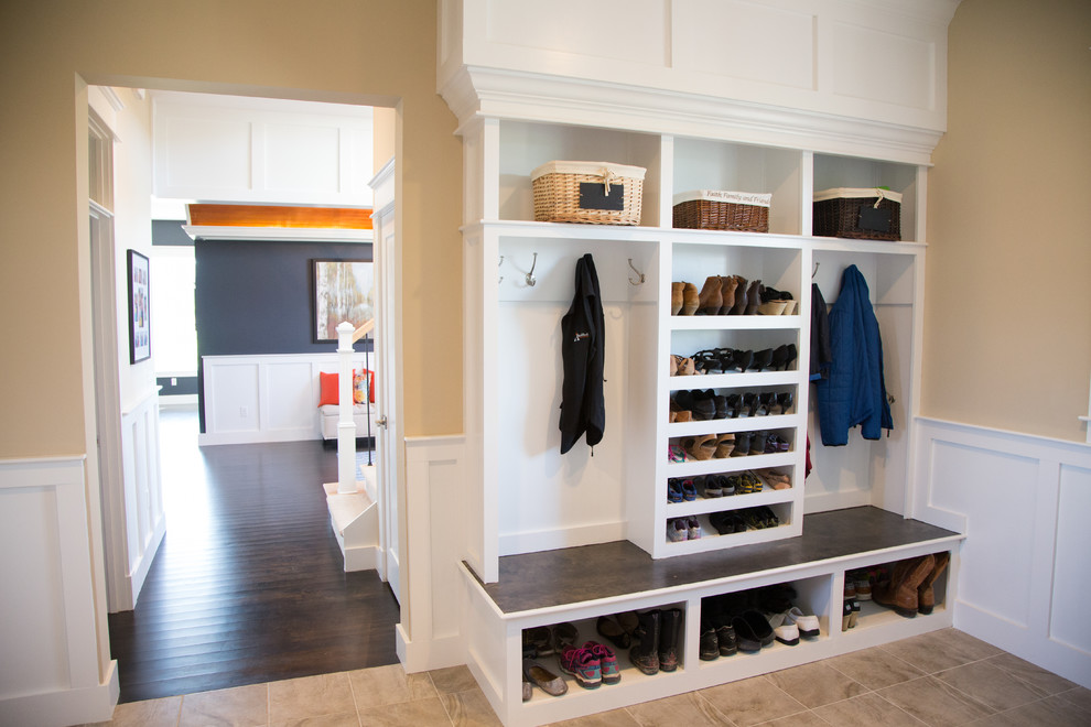 Walk-in closet - huge craftsman gender-neutral walk-in closet idea in Burlington with open cabinets and white cabinets