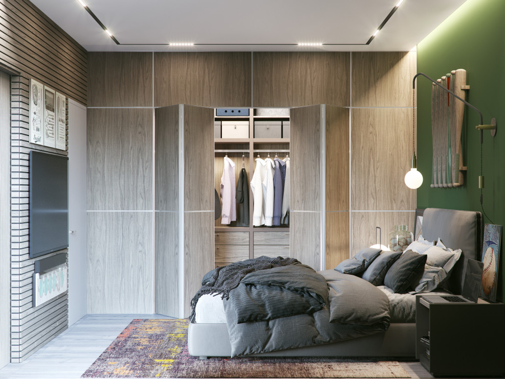 Esempio di un armadio incassato unisex minimalista di medie dimensioni con ante lisce e ante in legno chiaro