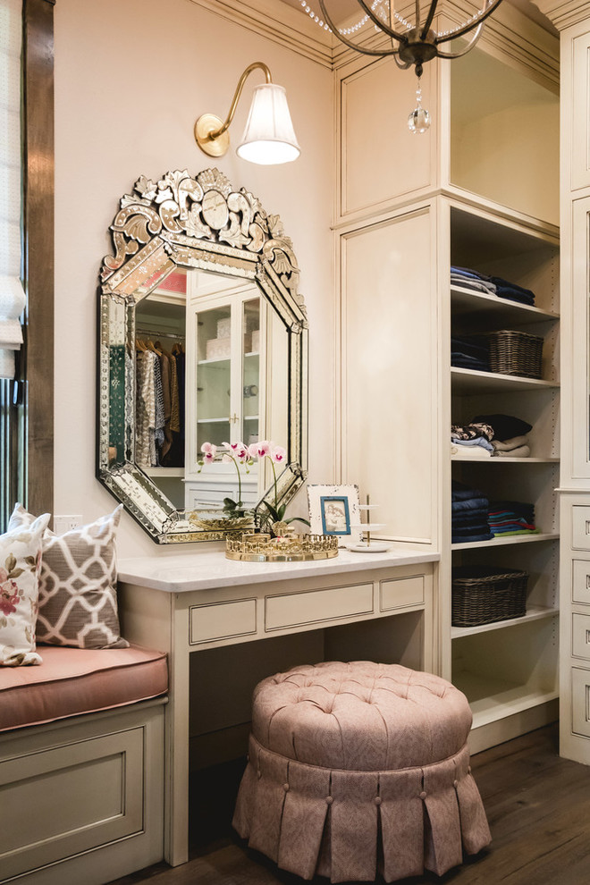 Inspiration for a timeless women's dark wood floor dressing room remodel in Oklahoma City with beaded inset cabinets and beige cabinets