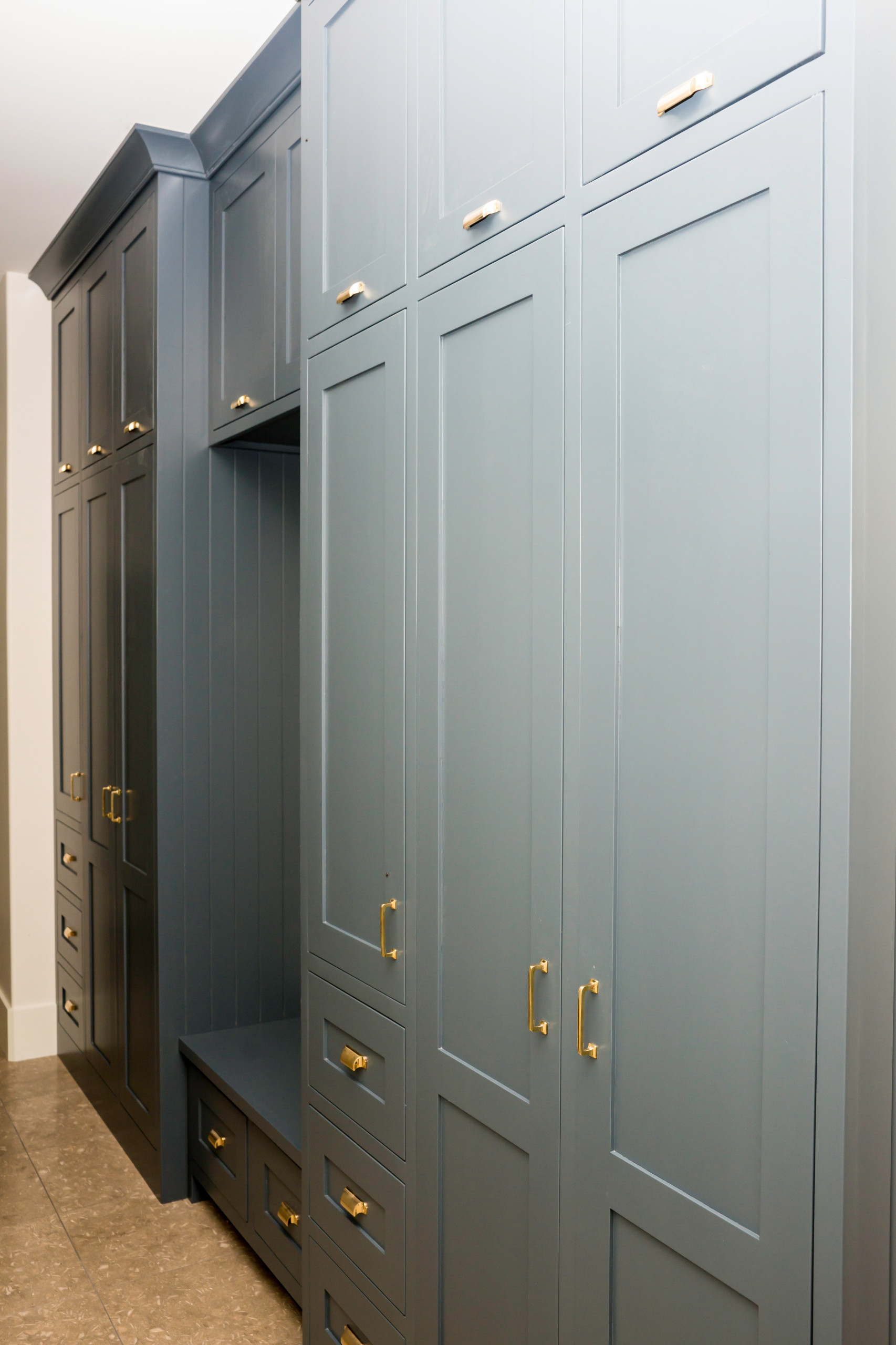Navy walk-in closet with Brass Furniture Knobs - Buster + Punch