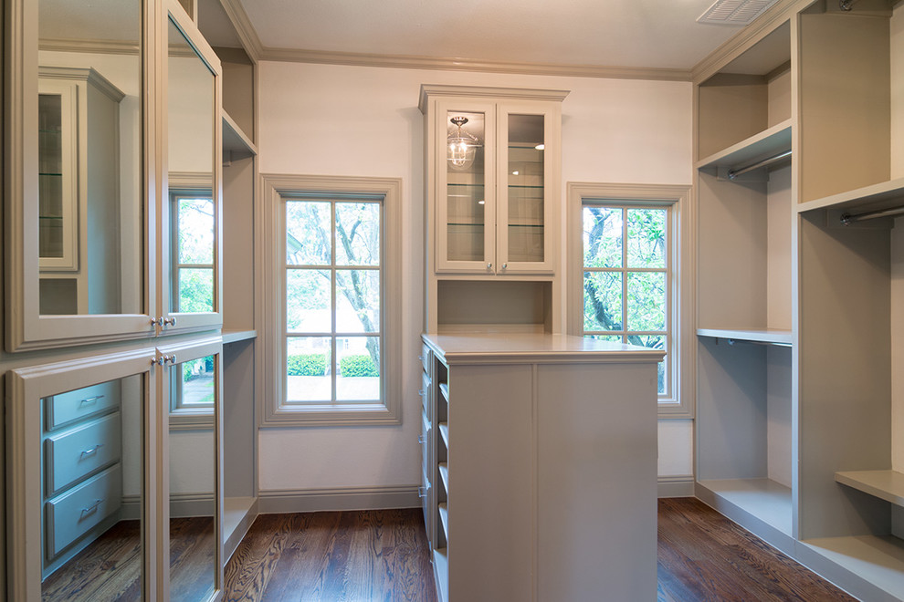 Design ideas for a medium sized traditional gender neutral walk-in wardrobe in Dallas with medium hardwood flooring, grey cabinets and recessed-panel cabinets.