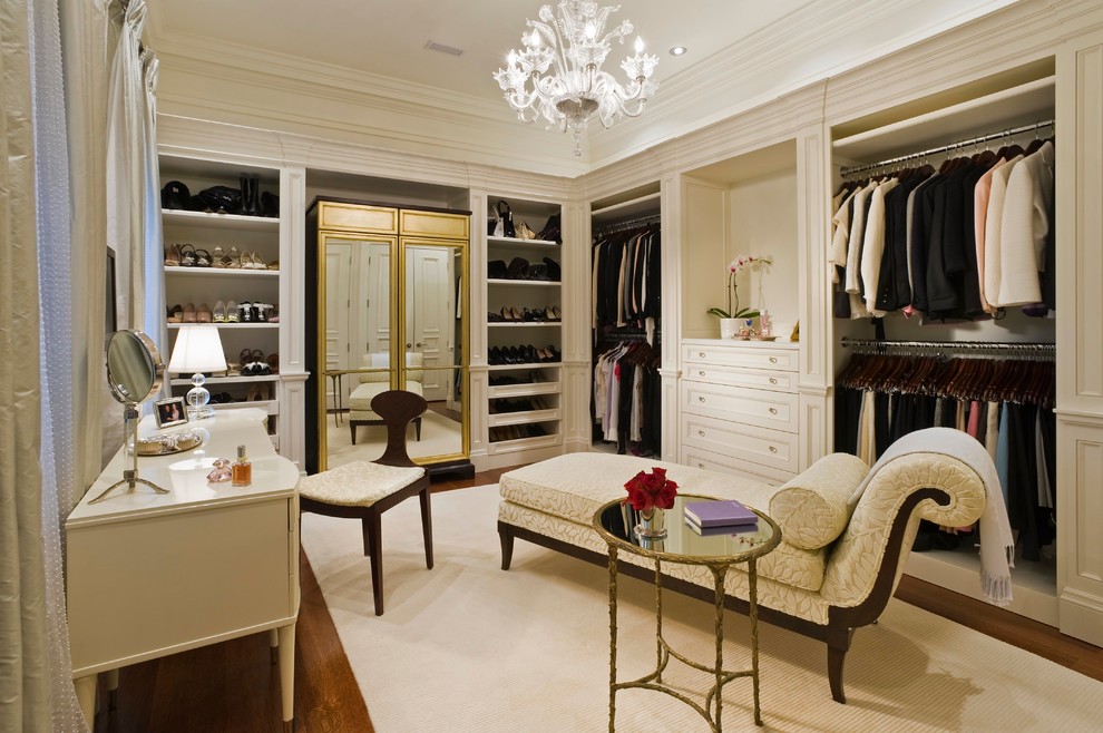 Example of a classic dressing room design in Toronto with beige cabinets
