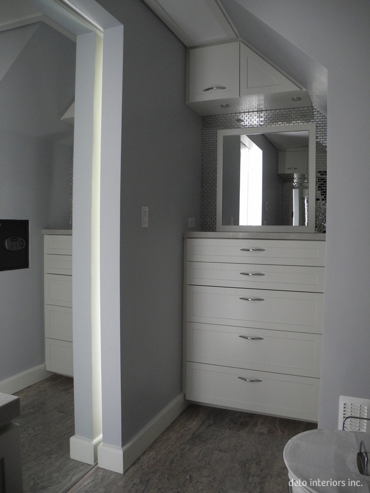 Inspiration for a small contemporary gender neutral walk-in wardrobe in Toronto with shaker cabinets, white cabinets and travertine flooring.