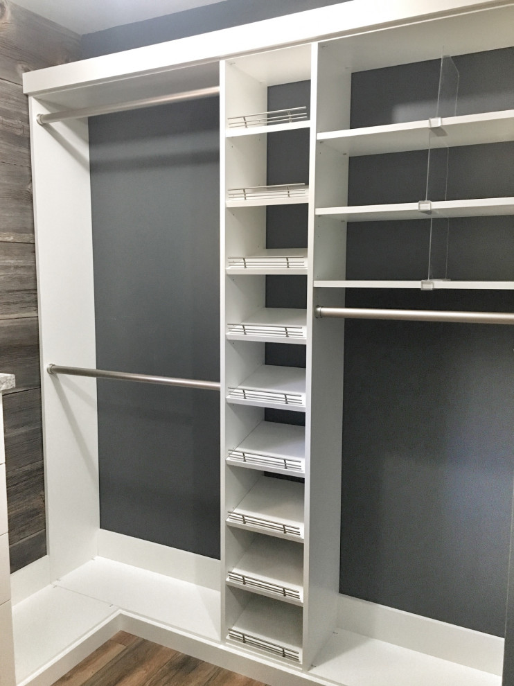 Walk-in closet - mid-sized transitional medium tone wood floor walk-in closet idea in St Louis with shaker cabinets and white cabinets
