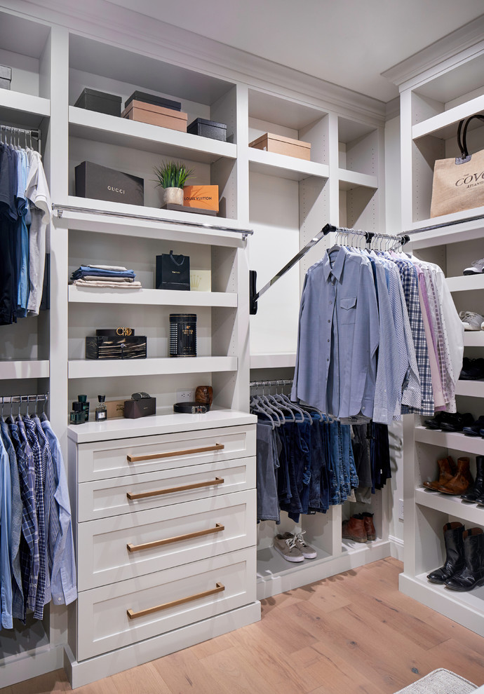 This is an example of a large traditional gender neutral walk-in wardrobe in Austin with shaker cabinets, grey cabinets, light hardwood flooring and grey floors.