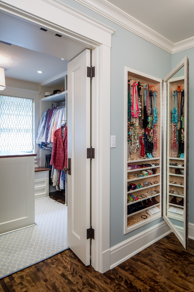 Inspiration for a large timeless women's dark wood floor dressing room remodel in Minneapolis with open cabinets and white cabinets