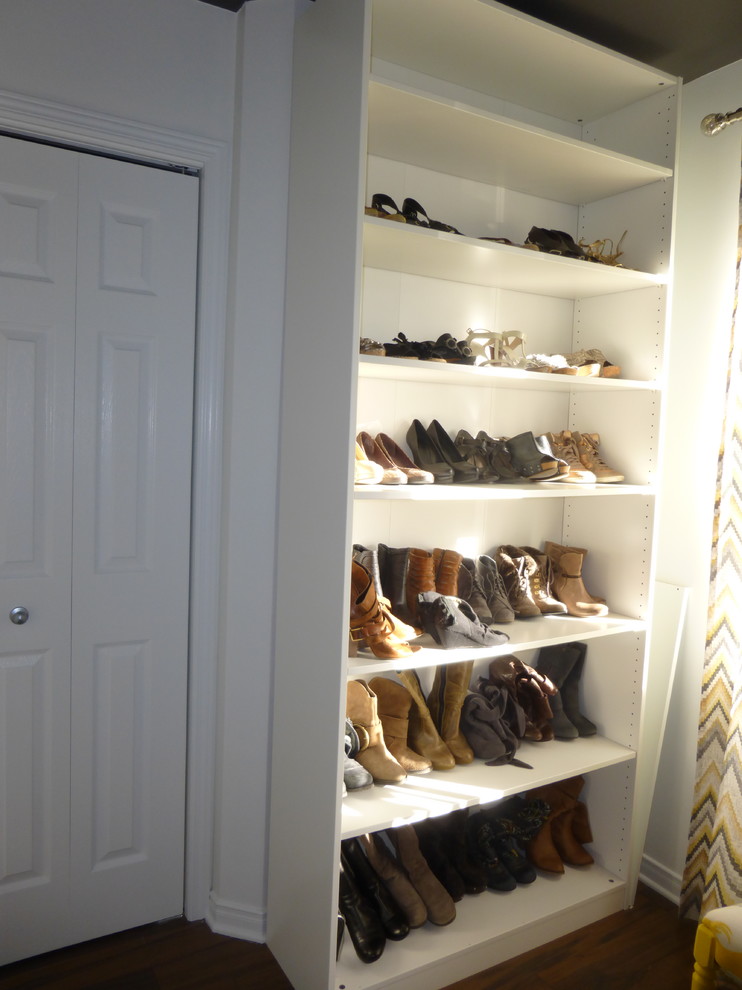 This is an example of a small traditional walk-in wardrobe for women in Montreal.