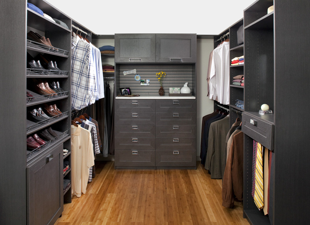 Inspiration for a modern walk-in closet remodel in Philadelphia with shaker cabinets and black cabinets
