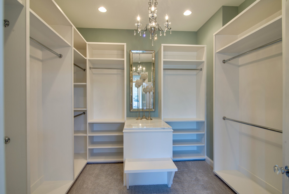 Inspiration for a medium sized classic gender neutral dressing room in Nashville with open cabinets, white cabinets and carpet.