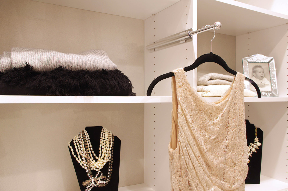 Mid-sized eclectic women's carpeted dressing room photo in New York with flat-panel cabinets and white cabinets