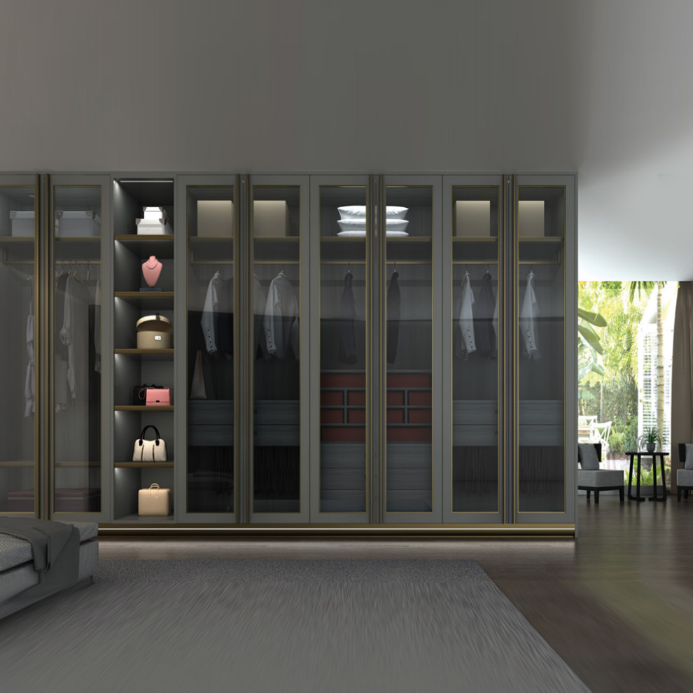 Esempio di un armadio o armadio a muro unisex di medie dimensioni con ante di vetro e ante grigie