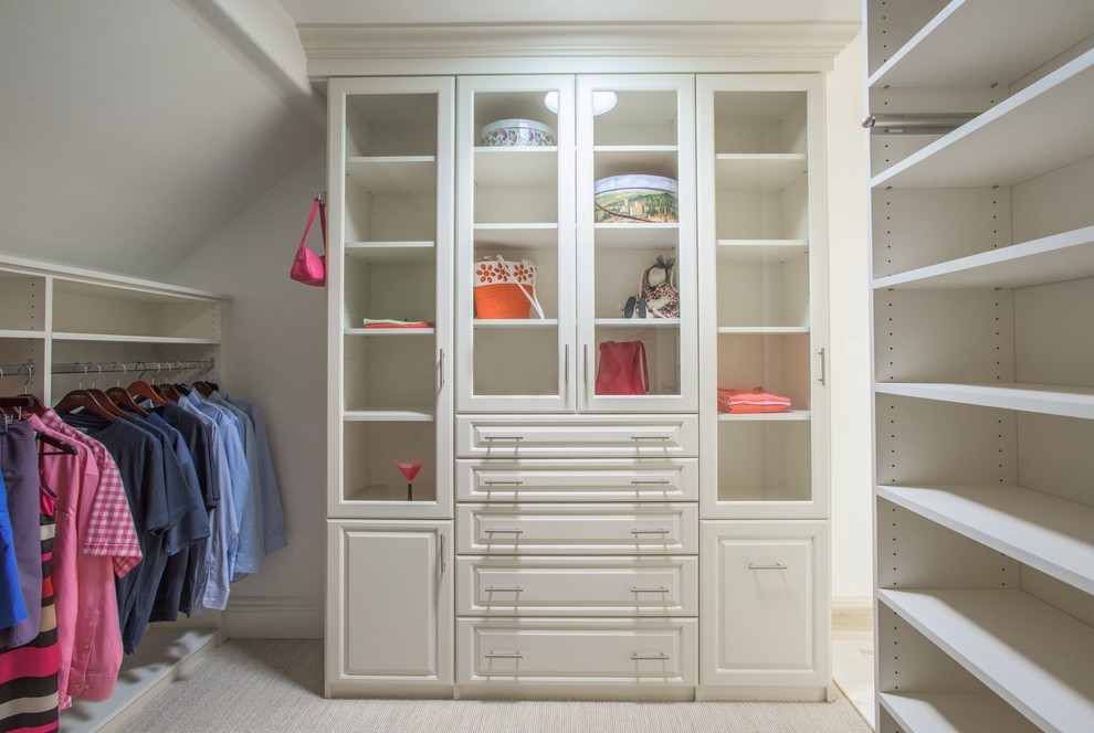 Traditional gender neutral wardrobe in Denver with raised-panel cabinets, white cabinets, carpet and white floors.